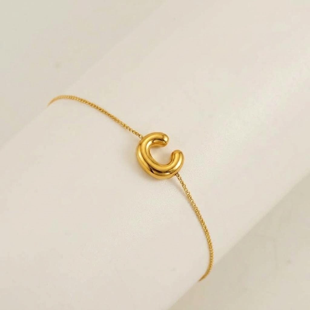 Le bracelet jonc initial Signature